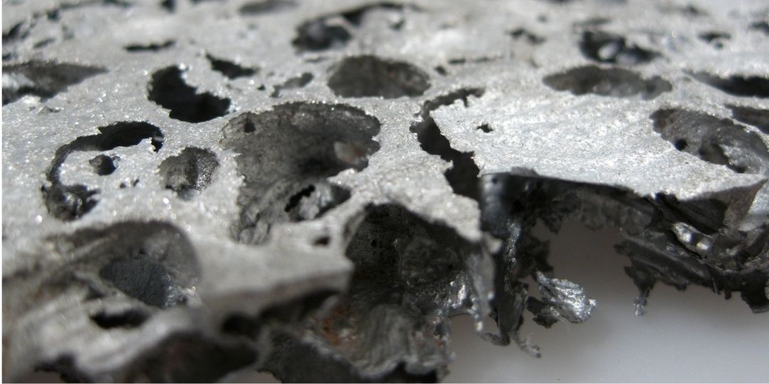 gray material with holes in it